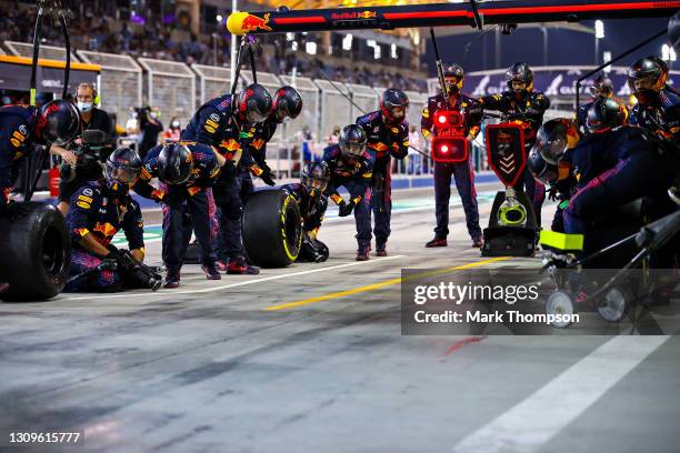 Red Bull Racing team members preapre for a pit stop during the F1 Grand Prix of Bahrain at Bahrain International Circuit on March 28, 2021 in...