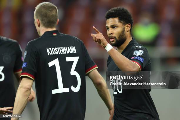 Serge Gnabry of Germany celebrates with team mate Lukas Klostermann after scoring their side's first goal during the FIFA World Cup 2022 Qatar...