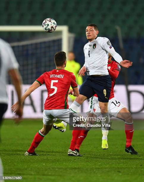 Andrea Belotti of Itlay competes for the ball with Petar Vitanov and Daniel Dimov of Bulgaria during the FIFA World Cup 2022 Qatar qualifying match...