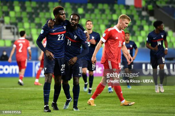 Odsonne Edouard of France celebrates with team mate Jonathan Ikone after scoring their side's first goal from the penalty spot during the 2021 UEFA...