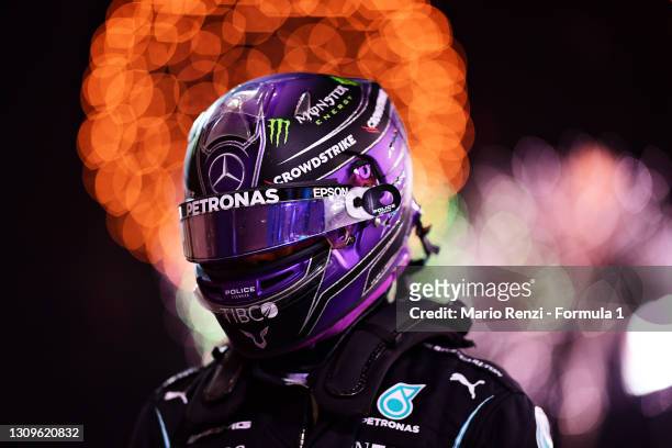 Race winner Lewis Hamilton of Great Britain and Mercedes GP looks on in parc ferme during the F1 Grand Prix of Bahrain at Bahrain International...