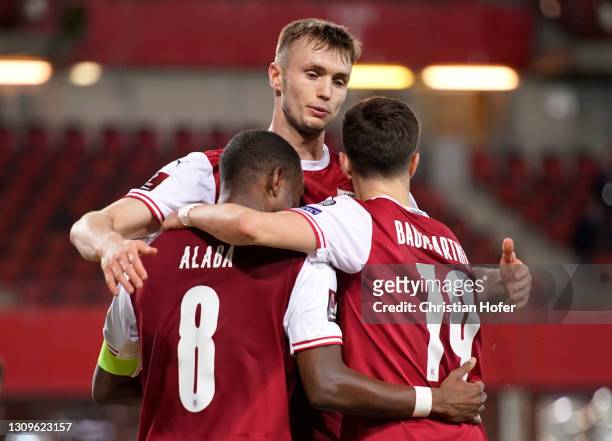Christoph Baumgartner of Austria celebrates with team mates after scoring their side's second goal during the FIFA World Cup 2022 Qatar qualifying...