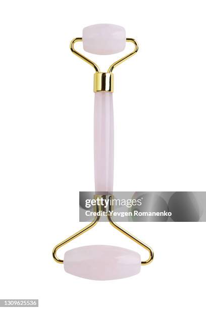 pink quartz face roller isolated on white background - 玉石滾輪 個照片及圖片檔