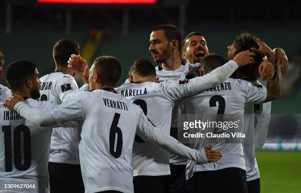 Manuel Locatelli of Italy celebrates with team mates after scoring the opening goal during the FIFA World Cup 2022 Qatar qualifying match between...
