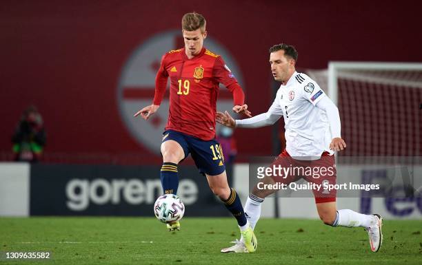 Otar Kakabadze of Georgia competes for the ball with Daniel Olmo of Spain during the FIFA World Cup 2022 Qatar qualifying match between Georgia and...