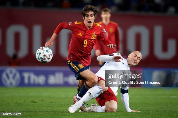 Bryan Gil of Spain is tackled by Jaba Kankava of Georgia during the FIFA World Cup 2022 Qatar qualifying match between Georgia and Spain at Boris...