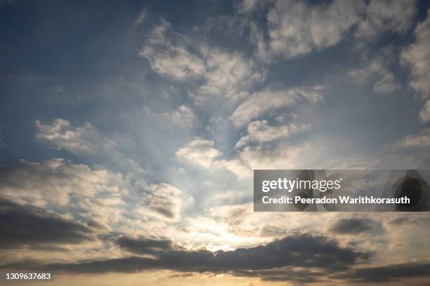 landscape scenery of empty earth of agricultural land in countryside area with golden light and dramatic cloud and sky during sunrise in the morning. - morning sky stock-fotos und bilder