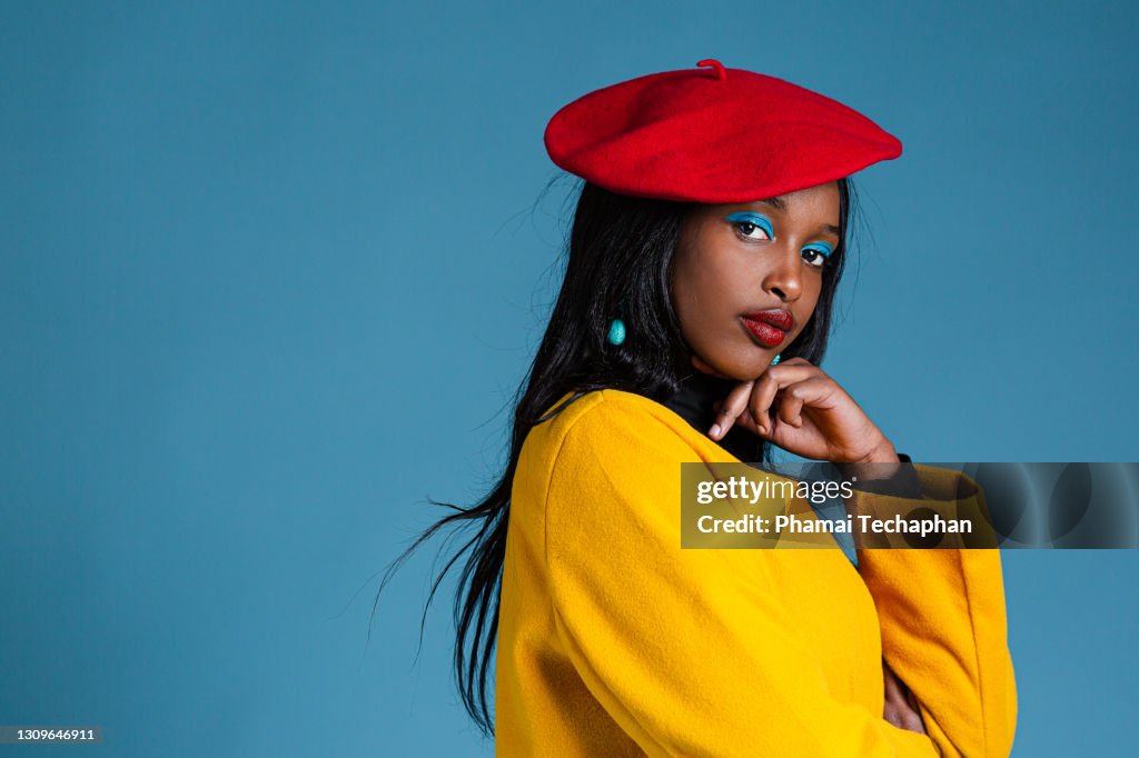 Fashionable woman wearing yellow coat