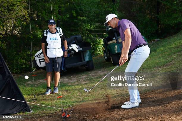 Victor Perez of France plays his shot on the 16th hole in his match against Matt Kuchar of the United States during the third place round of the...