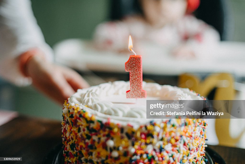 Baby First Birthday Cake with Lit Candle