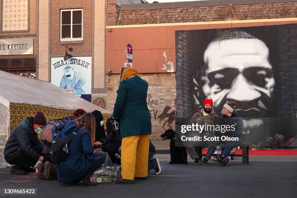 Community activists prepare candles for a vigil at a memorial near the site where George Floyd died at the hands of former Minneapolis police officer...