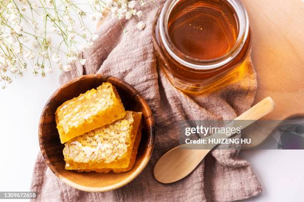 honeycombs with honey - honey jar stock pictures, royalty-free photos & images