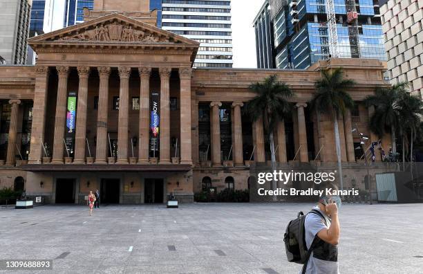 People are seen wearing face masks on the Queen Street Mall in the Brisbane CBD after Queensland Premier Annastacia Palazczuk announced a three-day...