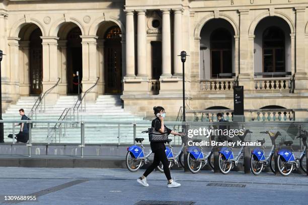 People are seen wearing face masks in the Brisbane CBD after Queensland Premier Annastacia Palazczuk announced a three-day lockdown for the Greater...