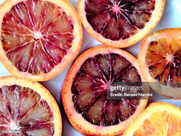blood oranges - blood orange isolated stock pictures, royalty-free photos & images