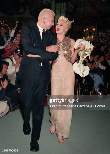 Fashion designer Jean Paul Gaultier and singer Madonna walk the runway during the Jean Paul Gaultier Ready to Wear Spring/Summer 1995 show as part of...