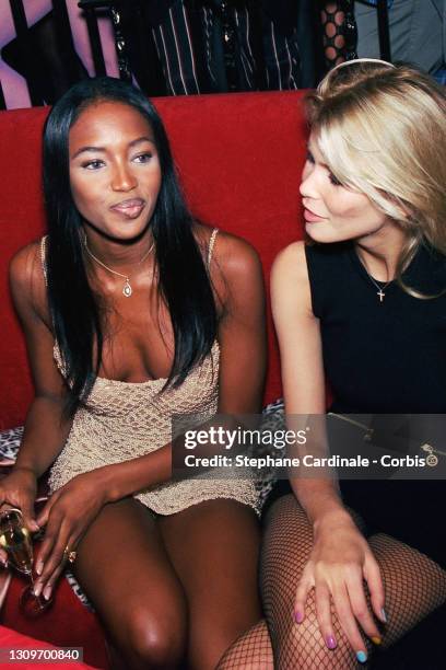 Naomi Campbell and Claudia Schiffer attend Naomi Campbell's Party as part of Paris Fashion Week at the Bataclan on October 14, 1994 in Paris, France.