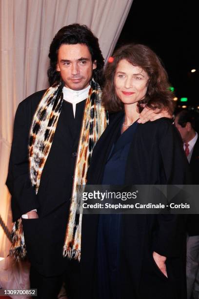 Jean-Michel Jarre and Charlotte Rampling attend the Gala Dinner on behalf of Aids victims at the Moulin Rouge on October 11, 1994 in Paris, France.