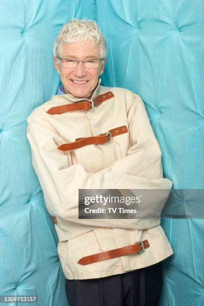 Television presenter Paul O'Grady posed in a straightjacket on July 26, 2010.