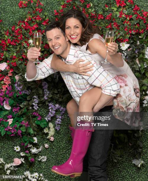 Matt Baker giving fellow Countryfile presenter Julia Bradbury a piggyback, circa 2014.