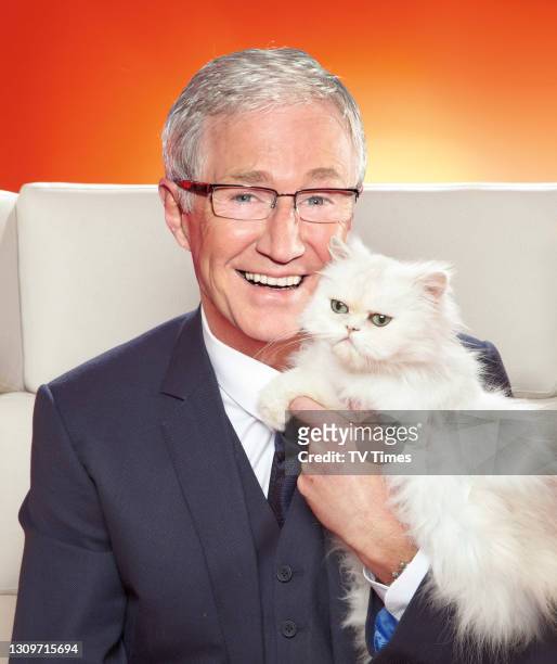 Television presenter Paul O'Grady posed with pet cat on April 9, 2011.