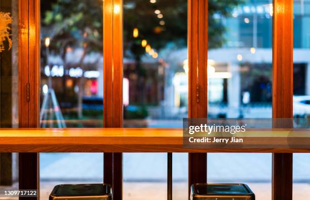 desk and windows at restaurant - barware stock-fotos und bilder