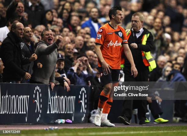 Tottenham Hotspur fans gesture towards Joey Barton of Queens Park Rangers during the Barclays Premier League match between Tottenham Hotspur and...