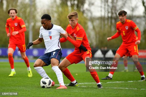 Karamoko Dembele of England challenged by Tom Davies of Wales during the International Friendly match between Wales U18 and England U18 at Leckwith...