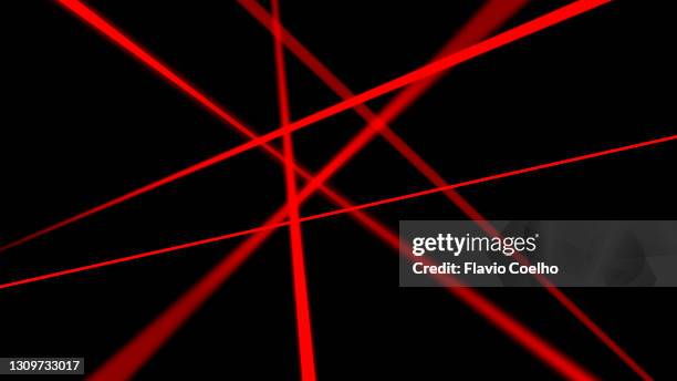 red laser beams on black background - emitir imagens e fotografias de stock