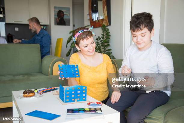 mother and son painting a building model - preteen model stock pictures, royalty-free photos & images