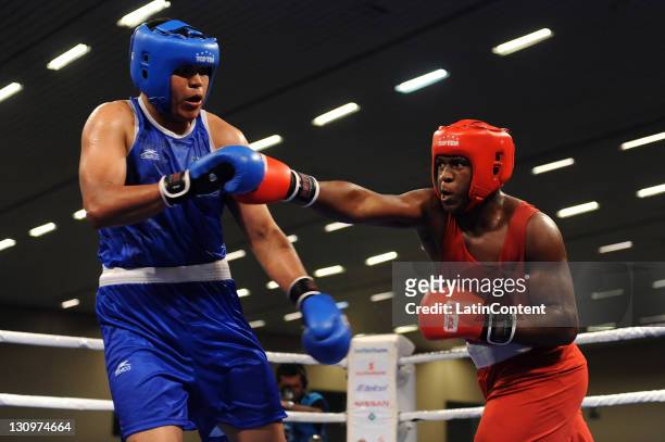 Ytalo Perea , of Ecuador, and Juan Hiracheta , of Mexico, in action during the final of the super heavy over 91kg category of boxing competition as...
