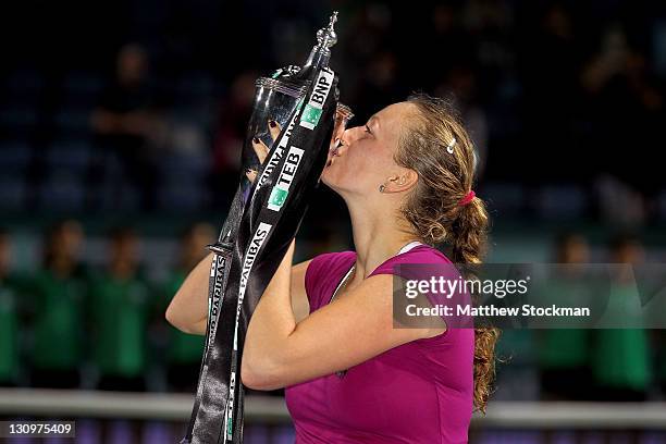 Petra Kvitova of the Czech Republic poses for photogrpahers with the Billie Jean King trophy after defeating Victoria Azarenka of Belarus during the...