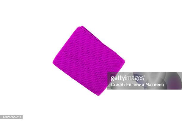 purple woven textile fitness sports elastic band twisted rolled isolated on white background - elastic bandage fotografías e imágenes de stock