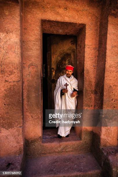 catholic priest from church of saint george, lalibela. ethiopia,africa - paparazzi x posed stock pictures, royalty-free photos & images
