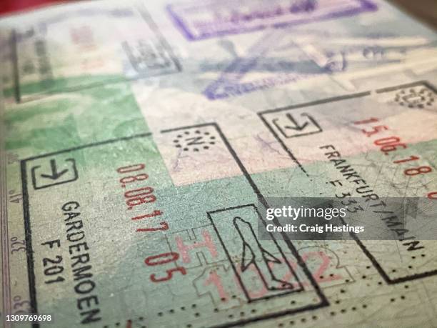 close up opened passport with entry stamps for frankfurt germany - passport stamp stock pictures, royalty-free photos & images