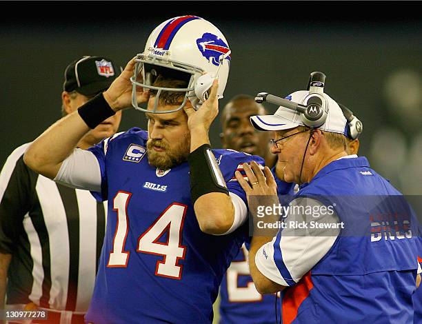 Ryan Fitzpatrick of the Buffalo Bills listens to head coach Chan Gailey during a time out against the Washington Redskins at Rogers Centre on October...