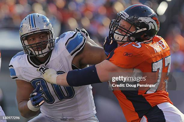 Defensive tackle Ndamukong Suh of the Detroit Lions battles against the block of offensive guard Chris Kuper of the Denver Broncos Sports Authority...