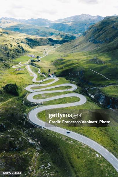 winding road in switzerland. - graubunden canton stock pictures, royalty-free photos & images