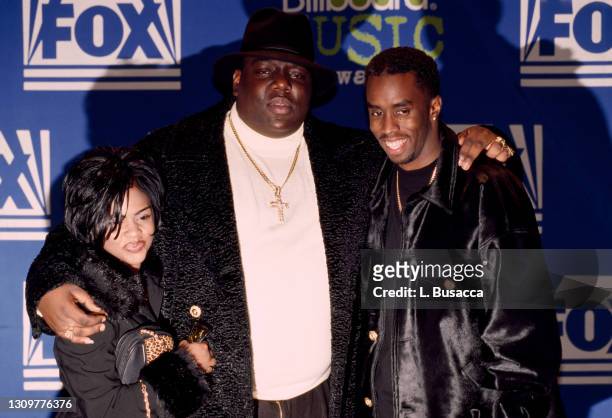 Rapper Notorious B.I.G. AKA Biggie Smalls joined by Sean Combs and Lil' Kim receives Billboard Music Award on December 6, 1995 at The Coliseum in New...