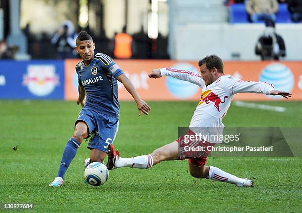 Teemu Tainio of the New York Red Bulls kicks the ball away from Sean Franklin of the Los Angeles Galaxy during the first half at Red Bull Arena on...