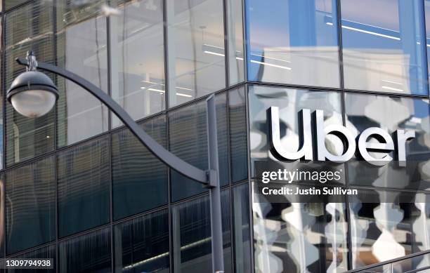 Sign is posted on the exterior of the new Uber headquarters on March 29, 2021 in San Francisco, California. Uber is allowing some employees to return...