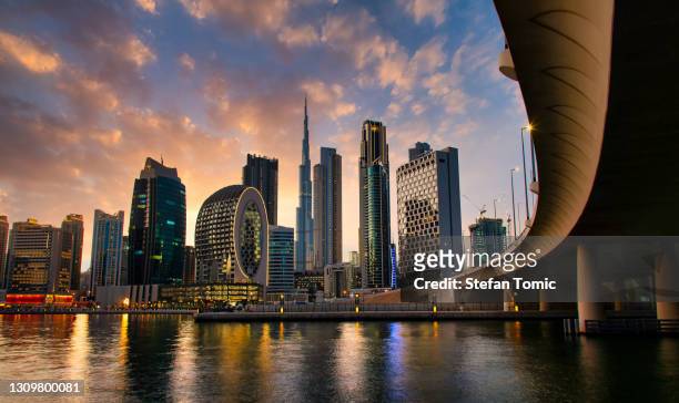 aerial skyline of downtown dubai filled with modern skyscrapers in the uae - dubai stock pictures, royalty-free photos & images