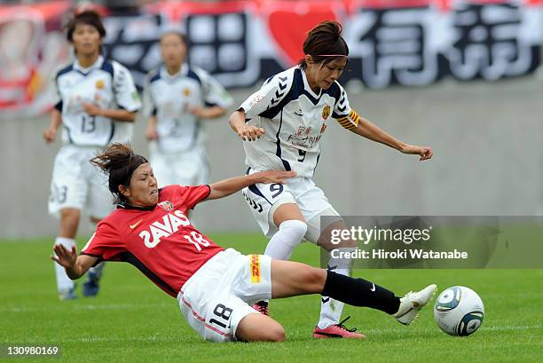 Nahomi Kawasumi of INAC Kobe Leonessa and Miyuki Yanagita of Urawa Red Diamonds Ladies compete for the ball during the Nadeshiko League match between...