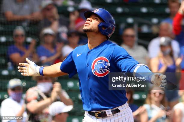 Willson Contreras of the Chicago Cubs celebrates while lapping the bases after hitting a solo home run in the third inning against the Arizona...