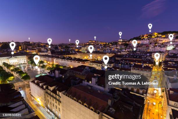 map pin icons on lisbon cityscape at dusk. - mapa portugal imagens e fotografias de stock