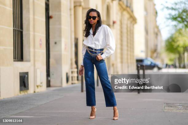 Emilie Joseph @in_fashionwetrust wears a white Boyfriend shirt from &other stories, high rise straight ribcage jeans from Levis', high heels shoes...
