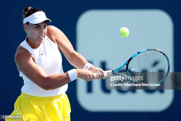 Ana Konjuh of Croatia returns a shot to Anastasija Sevastova of Latvia during the Miami Open at Hard Rock Stadium on March 29, 2021 in Miami Gardens,...