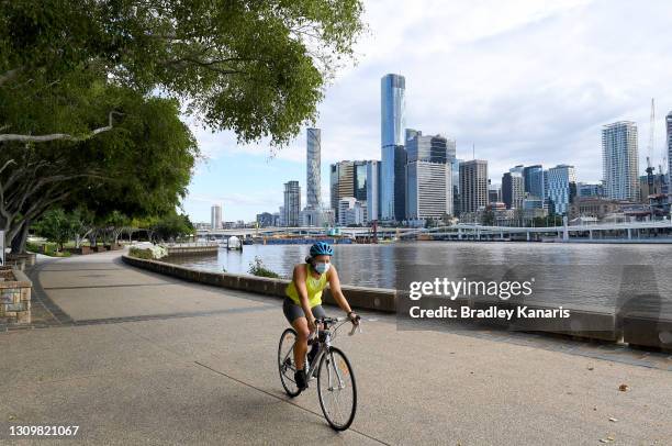 People are seen doing their early morning exercise on March 30, 2021 in Brisbane, Australia. The Greater Brisbane area is under lockdown for three...
