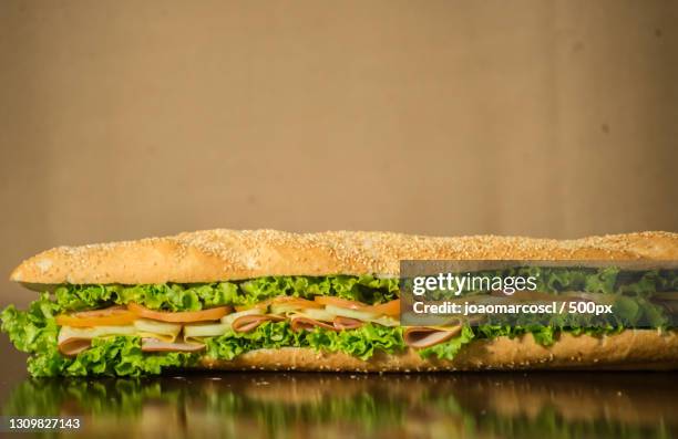 close-up of sandwich on table - submarine sandwich stock pictures, royalty-free photos & images