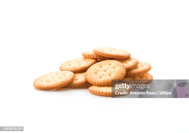 close-up of cookies against white background - crackers stock pictures, royalty-free photos & images